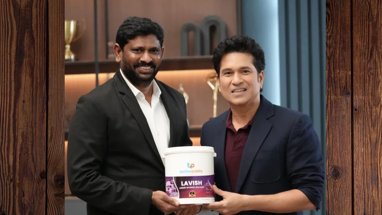 Sachin Tendulkar stands with Techno Paints chairman Akuri Srinivas Reddy holding a paint product during brand ambassador announcement