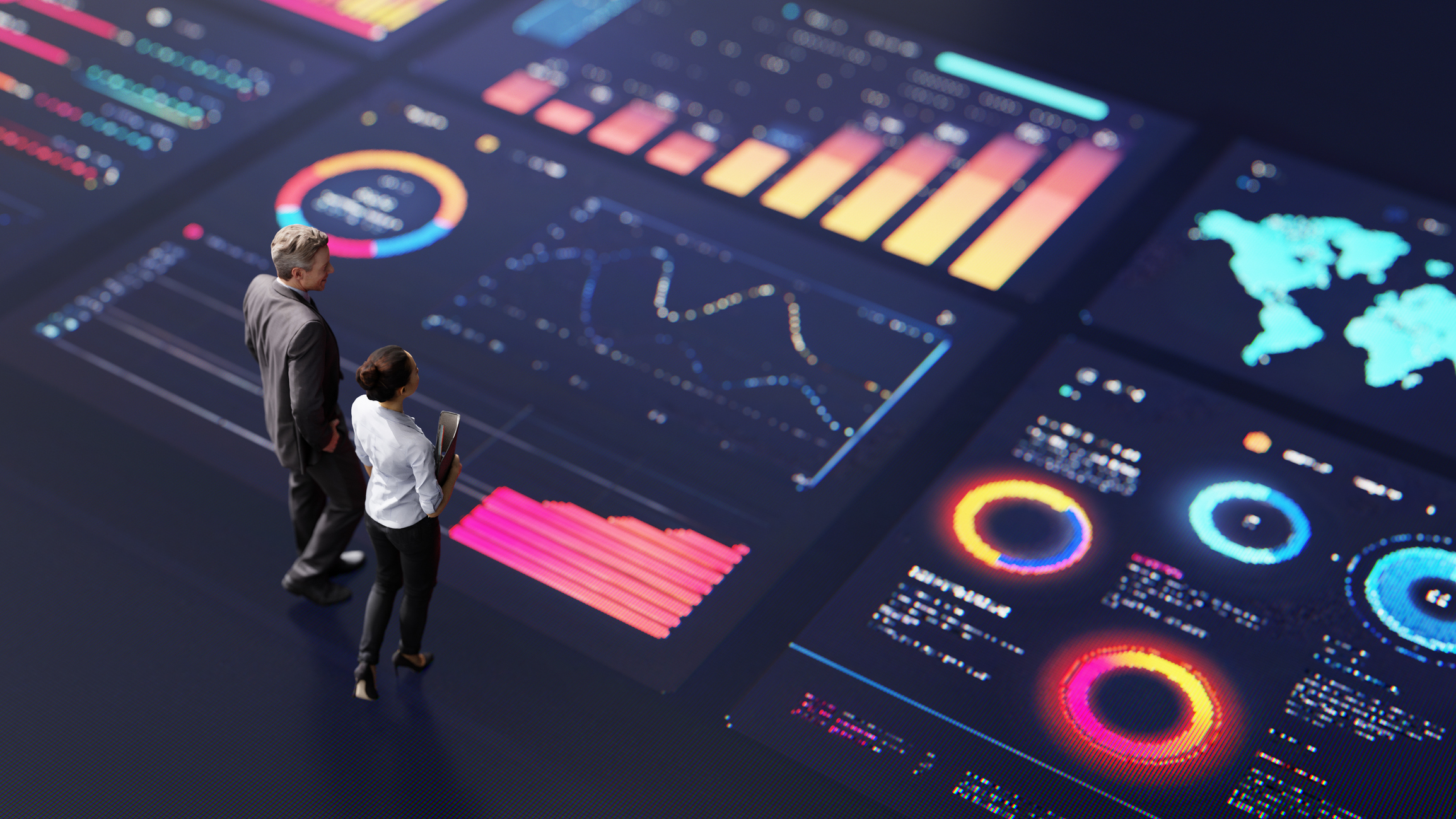 Two professionals analysing a digital financial dashboard with charts and graphs representing personal finance planning and investment decisions.