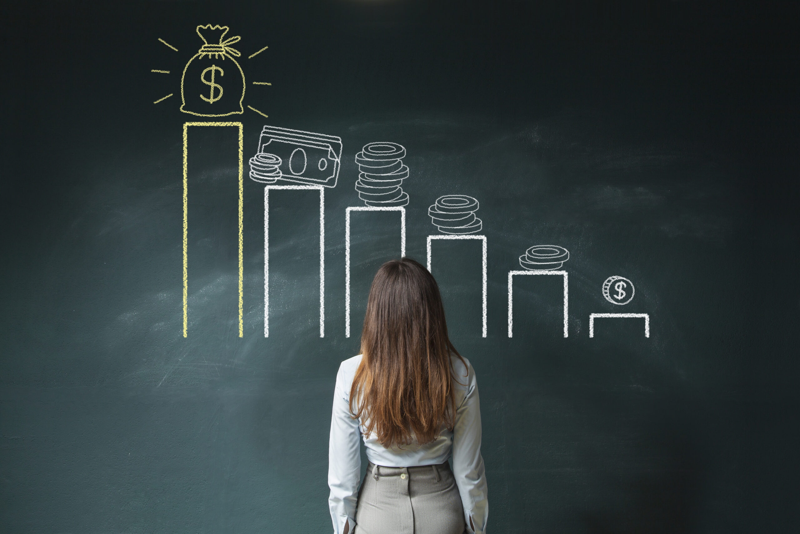Woman looking at financial chart showing income and savings levels, representing salary growth and wealth building challenges.